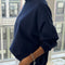 side view of model wearing relaxed fit navy french terry quarter zip sweatshirt