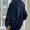 back view of model wearing relaxed fit navy french terry quarter zip sweatshirt