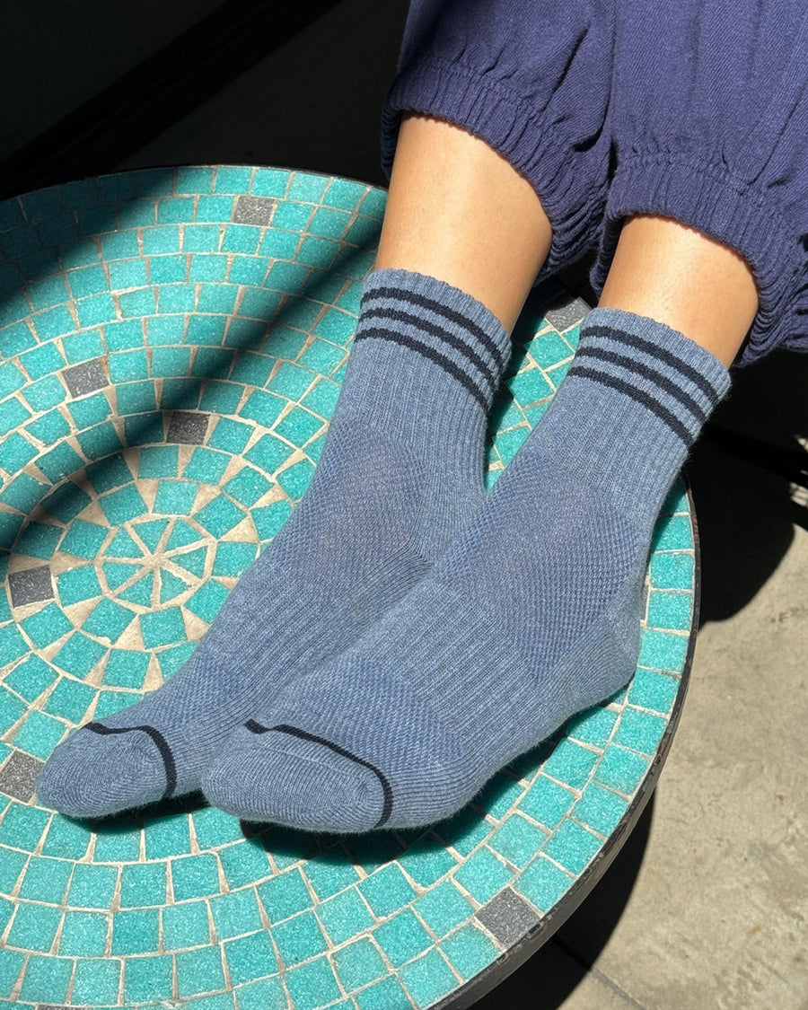 model wearing indigo socks with navy stripes on the top