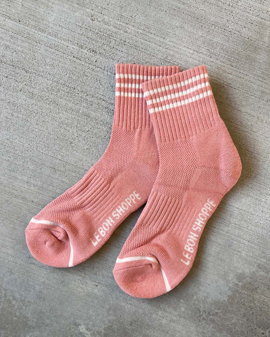salmon high crew socks with three white stripes at the top