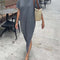 model wearing smokey grey short sleeve cotton maxi dress with side slits