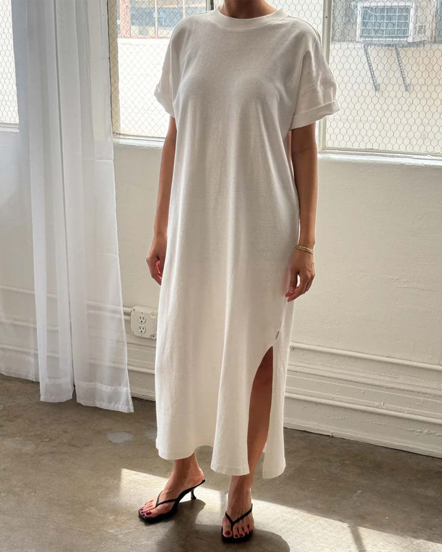 model wearing white short sleeve cotton maxi dress with side slits