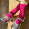 model wearing fuchsia pink ribbed crew socks