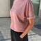 side view of model wearing mauve relaxed fit cotton tee