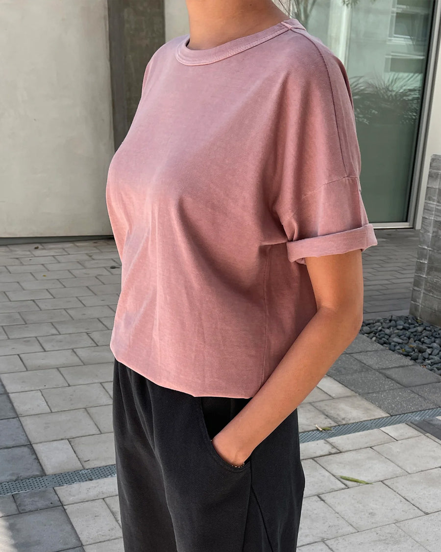 side view of model wearing mauve relaxed fit cotton tee