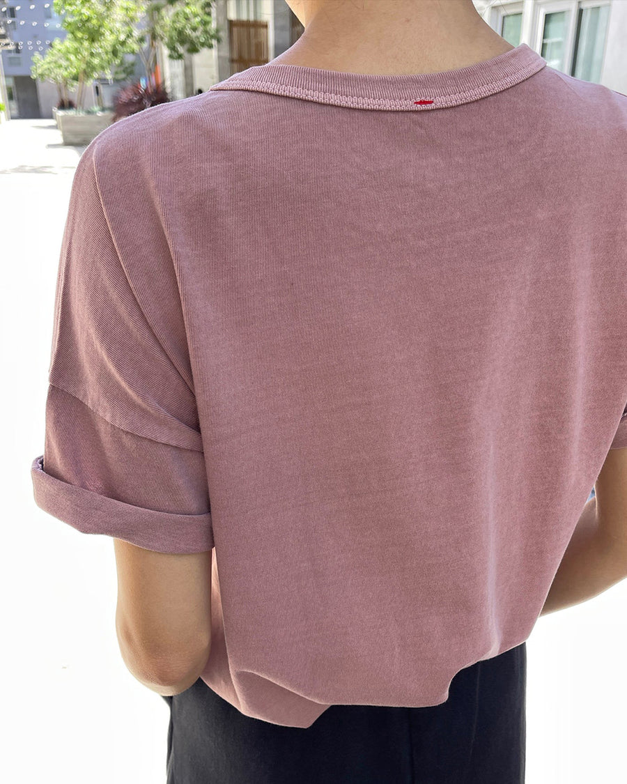 back view of model wearing mauve relaxed fit cotton tee