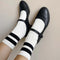 model wearing cream high crew socks with two thick black stripes at the top