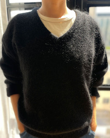 model wearing v-neck mohair sweater in black