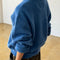 back view of model wearing v-neck mohair sweater in royal blue 