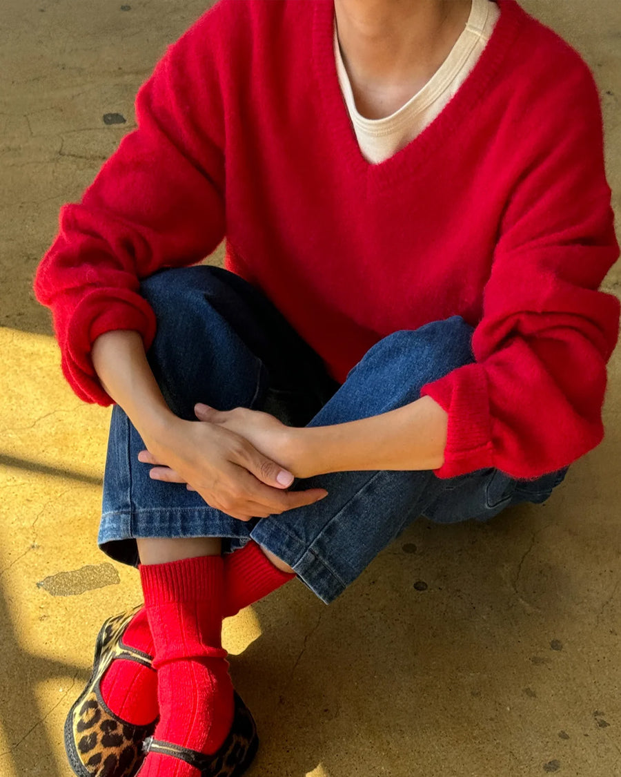 model wearing red v-neck mohair sweater