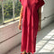 model wearing red maxi dress with slight cap sleeves and side slits