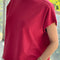 model wearing red tee with slight muscle sleeves and slight crop