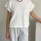 model wearing white tee with slight muscle sleeves and side slits