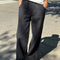 model wearing black relaxed fit cotton canvas pants with side pockets