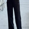 model wearing black relaxed fit cotton canvas pants with side pockets