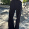 model wearing black relaxed fit cotton canvas pants with side pockets