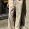 front view of model wearing cream (naturel) relaxed fit cotton canvas pants with side pockets