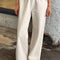 model wearing cream (naturel) relaxed fit cotton canvas pants with side pockets