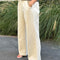 side view of model wearing cream (naturel) relaxed fit cotton canvas pants with side pockets