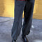 model wearing dark grey (coal) french terry balloon pants with side pockets