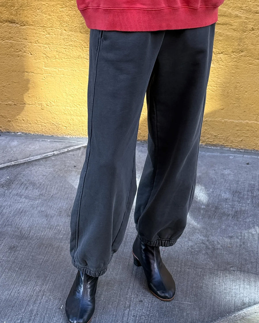 model wearing dark grey (coal) french terry balloon pants with side pockets