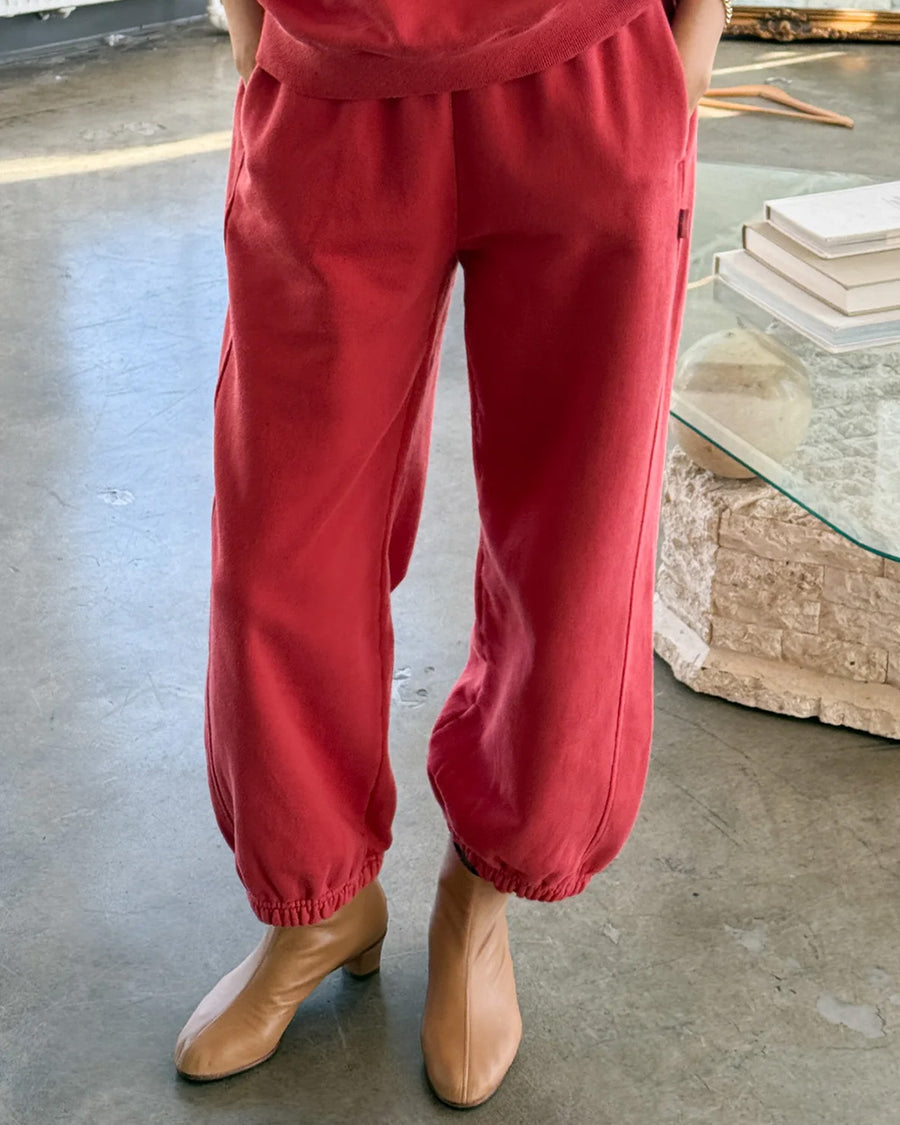 model wearing red french terry balloon pants with side pockets