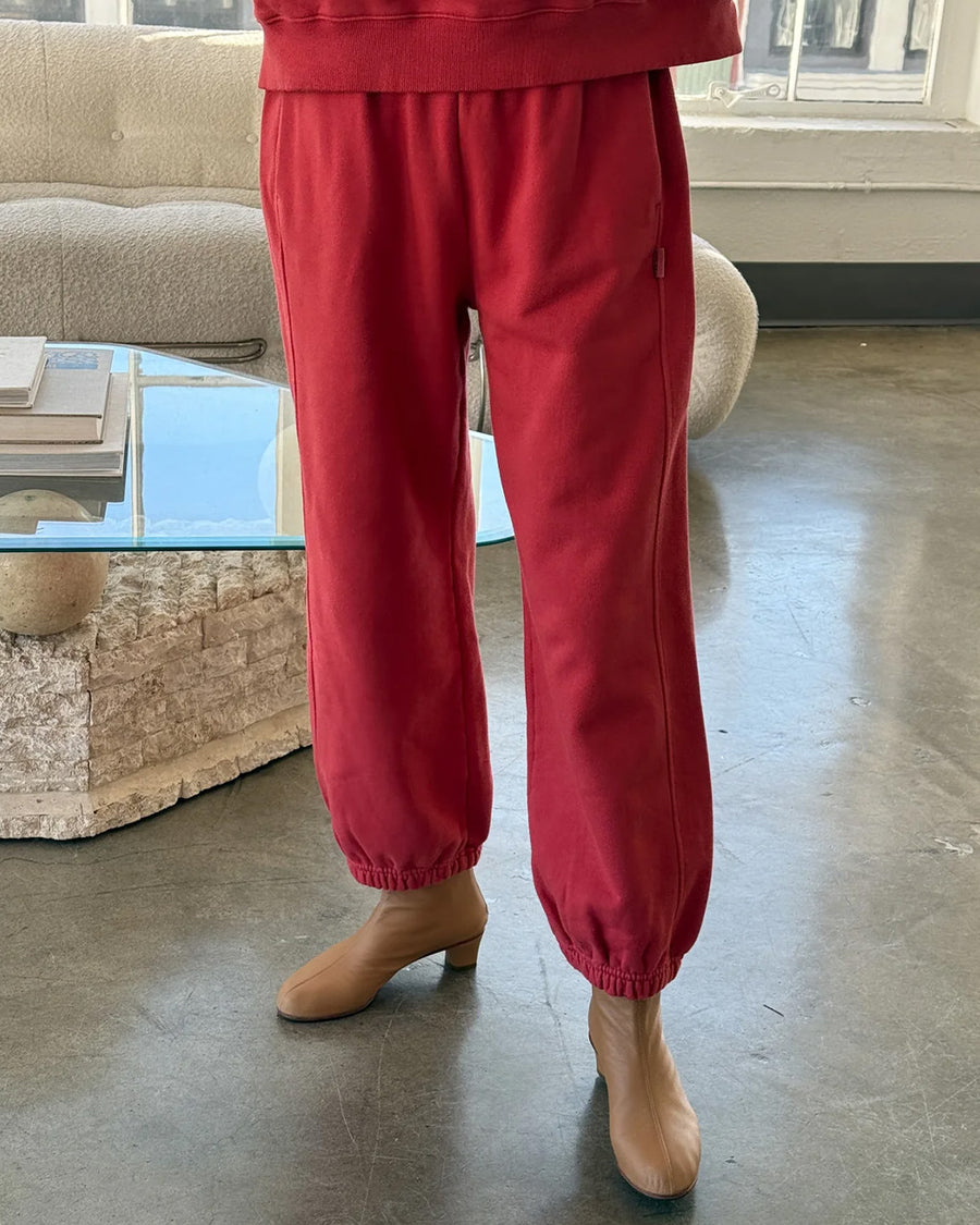 up close of model wearing red french terry balloon pants with side pockets