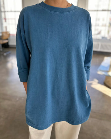 model wearing ocean cotton long sleeve tunic with deep side slits