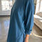 side view of model wearing ocean cotton long sleeve tunic with deep side slits