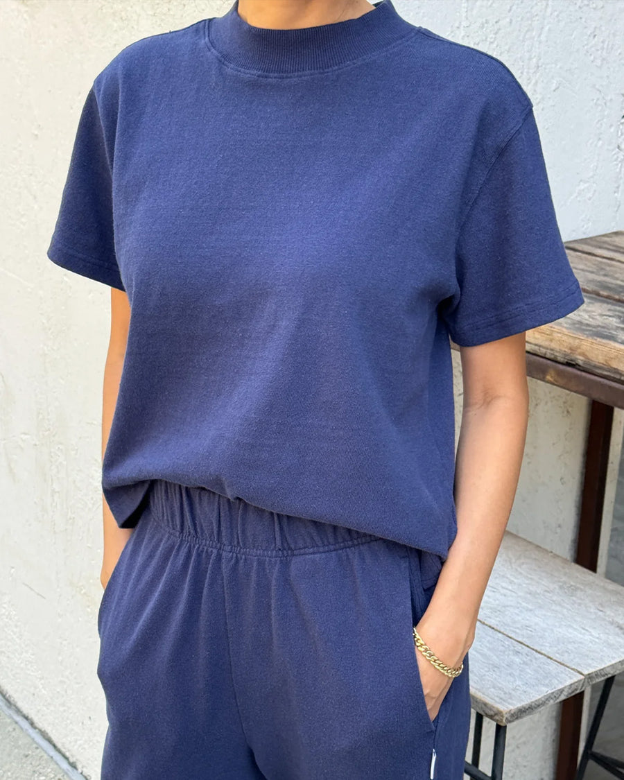 model wearing midnight colored short sleeve mock neck tee