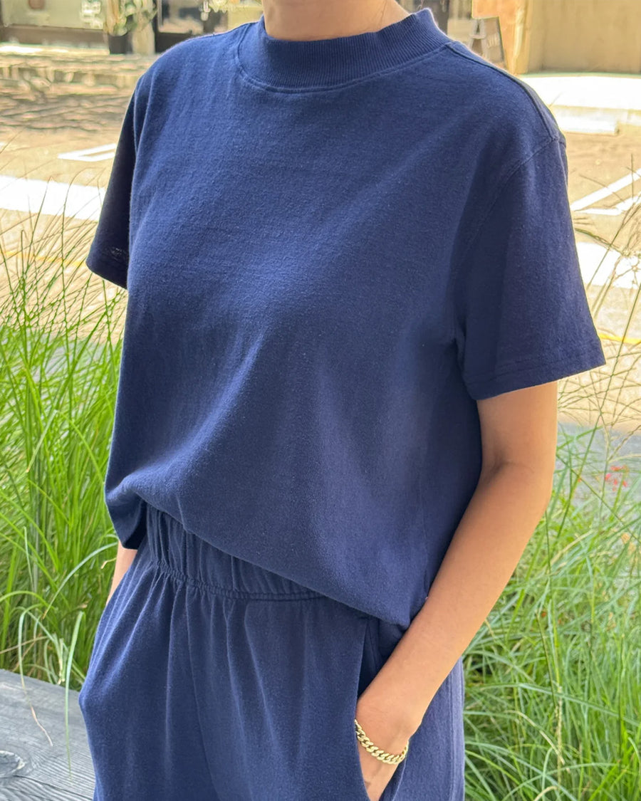 model wearing midnight colored short sleeve mock neck tee