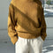 model wearing mustard yellow cotton sweater with thick banded bottom and mockneck