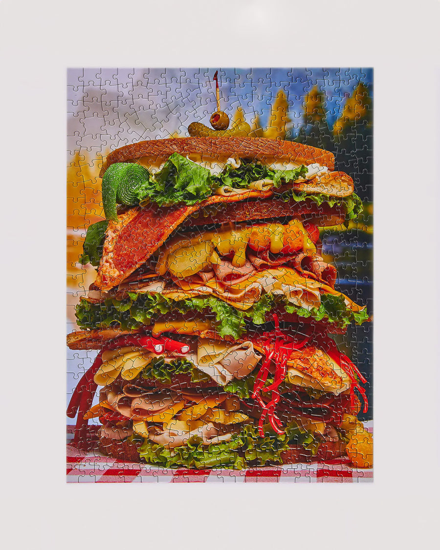 completed le puzz 500 puzzle with a giant loaded sandwich