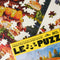 up close of le puzz 500 puzzle with a giant loaded sandwich