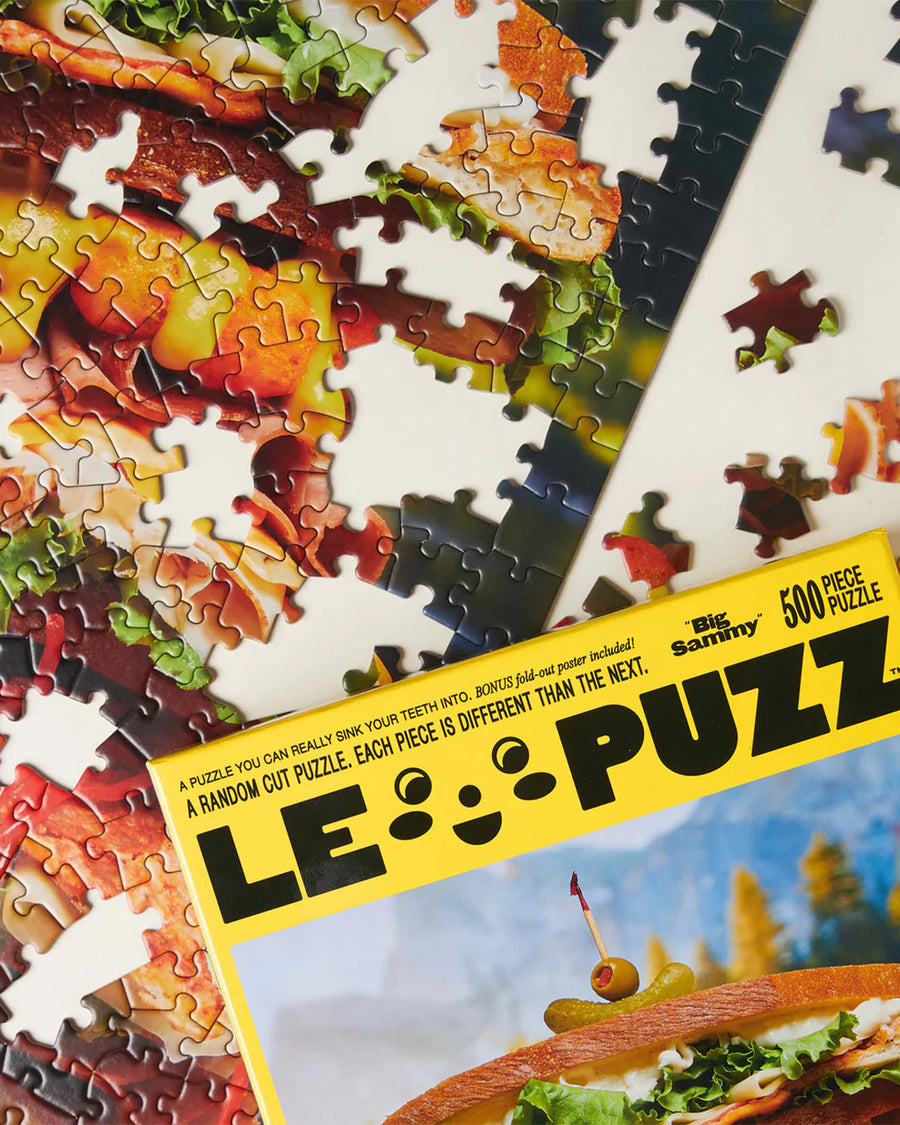 up close of le puzz 500 puzzle with a giant loaded sandwich