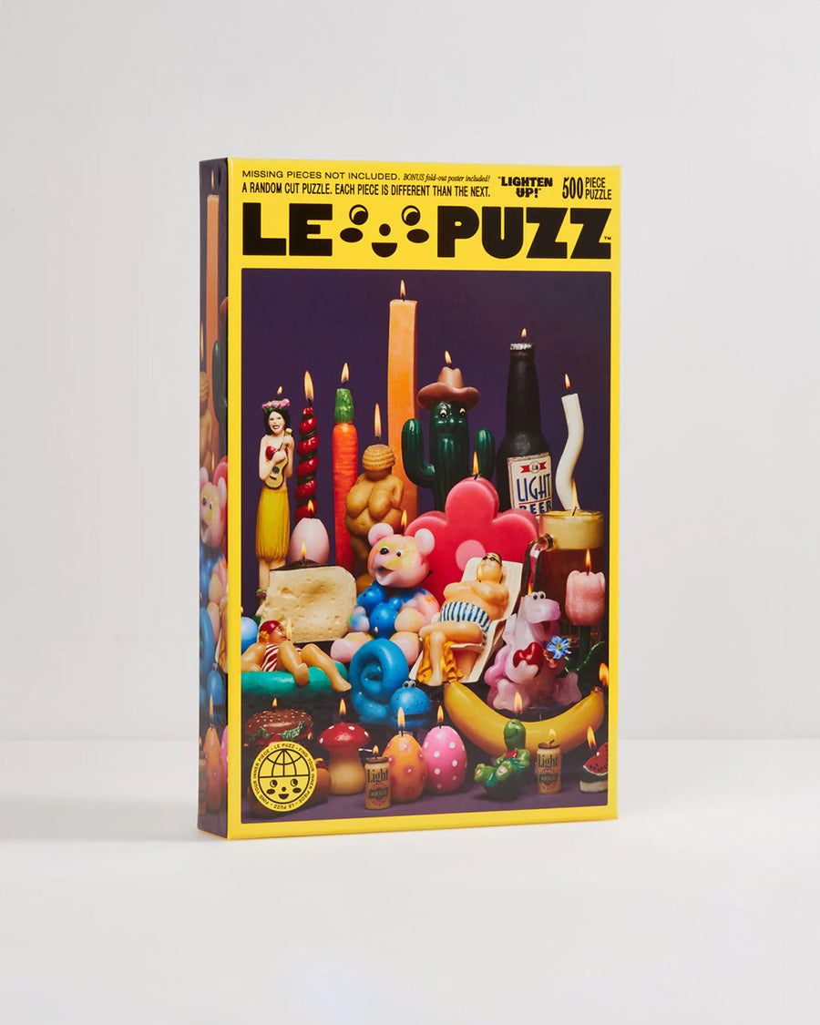 boxed le puzz 500 piece puzzle with various novelty lit candles