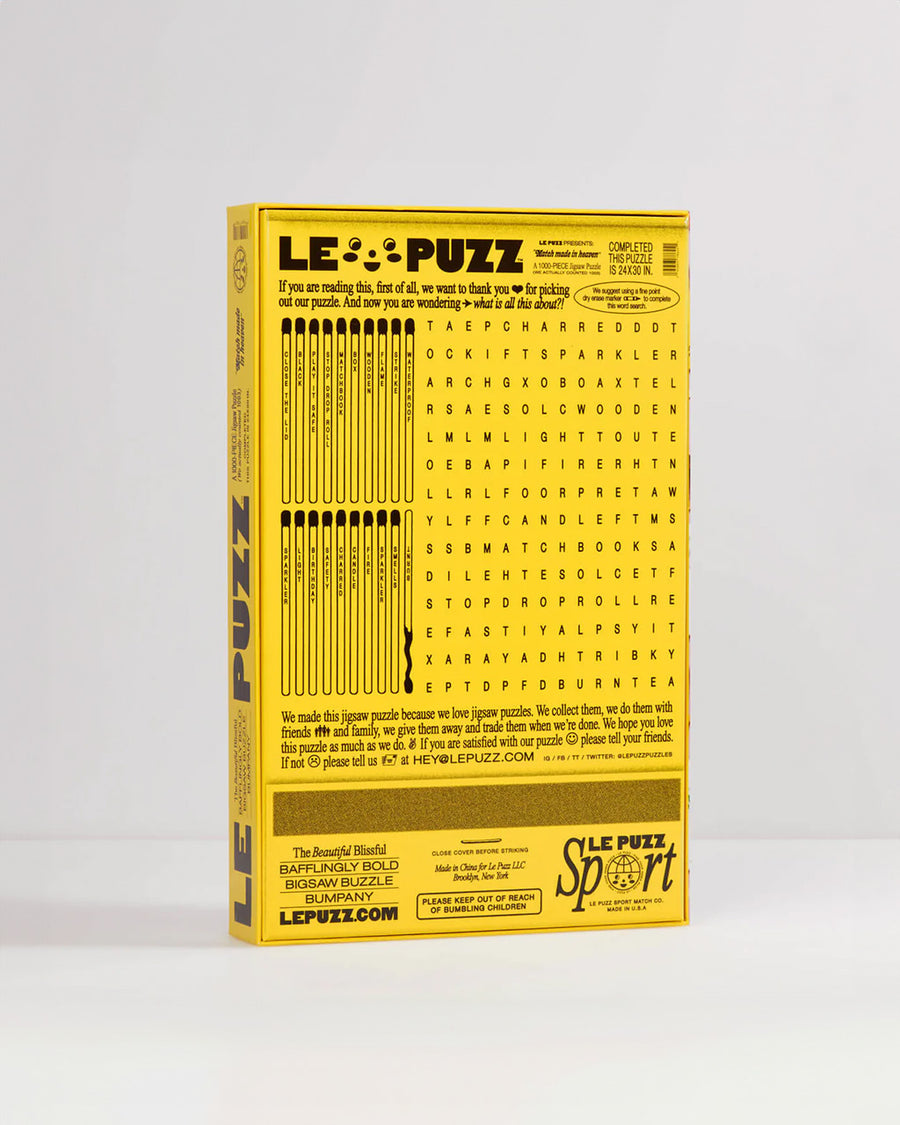 back view of le puzz 1000 piece puzzle with pink ground and cute and colorful matchbooks