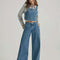 model wearing low rise wide leg denim carpenter pants