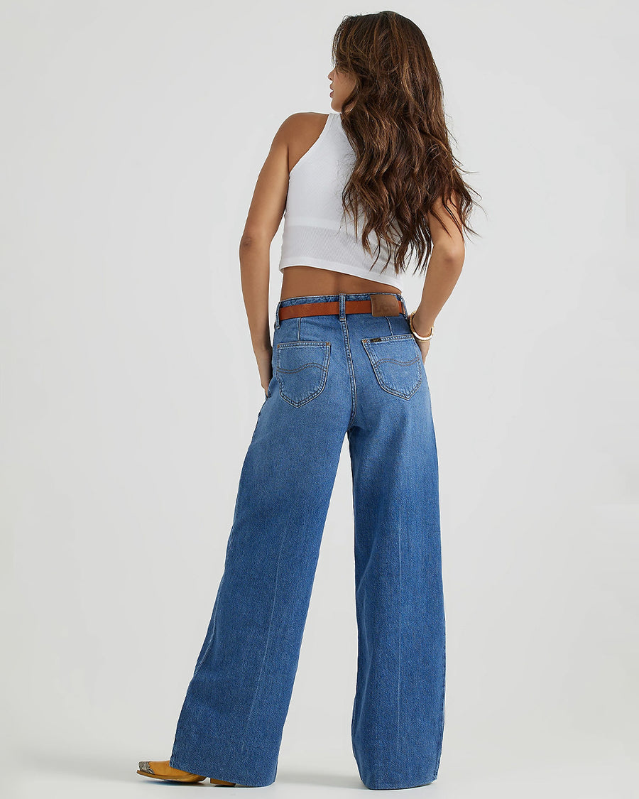 back view of model wearing medium denim a-line trouser