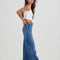 side view of model wearing medium denim a-line trouser