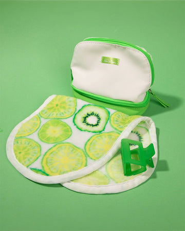 makeup eraser pro gift set includes white makeup eraser with all over kiwi print, lime green hair claw and a white and lime green zip pouch