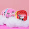 set of 7 various hello kitty reusable makeup wipes with laundry bag against pink ground and sitting on 'clouds'