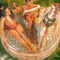 top view of model relaxing in clear inflatable pool with rattan colored lines and scalloped top