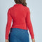 back view of model wearing red fuzzy textured long sleeve polo neck top