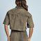 back view of model wearing cropped chocolate acid wash button down top with heart shaped front pockets