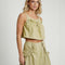 model wearing moss cropped linen tank with ruffle bust detail and matching midi skirt