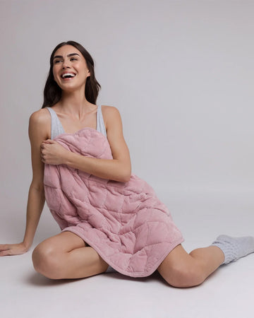 model holding pink weighted body blanket