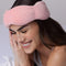 model wearing blush pink weighted sleep mask