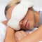 model wearing bone weighted eye mask over their eyes 