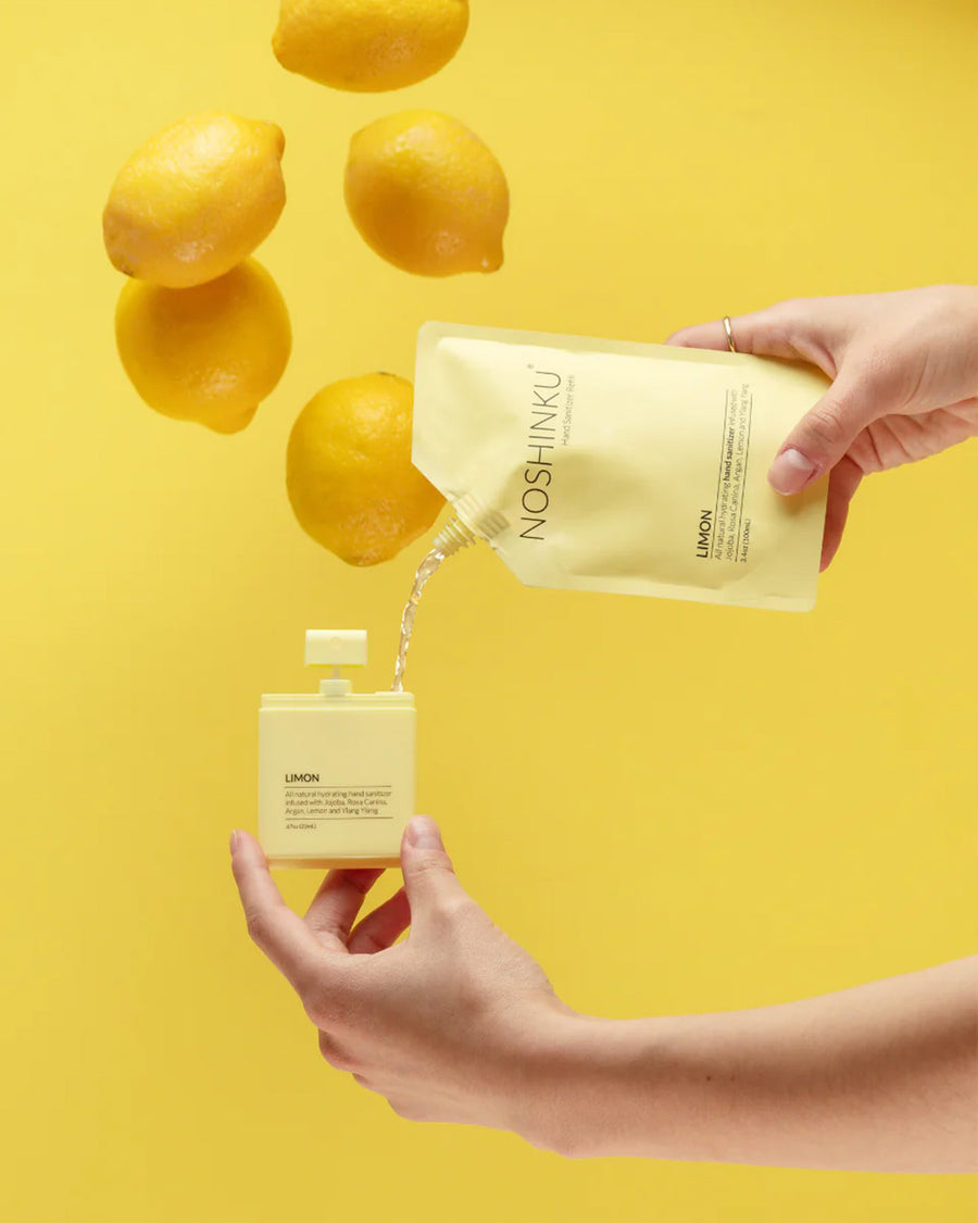 model pouring lemon refill liquid into pocket hand sanitizer